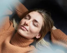 girl with hands behind head