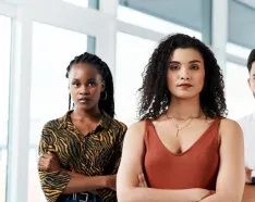 Three people hands crossed