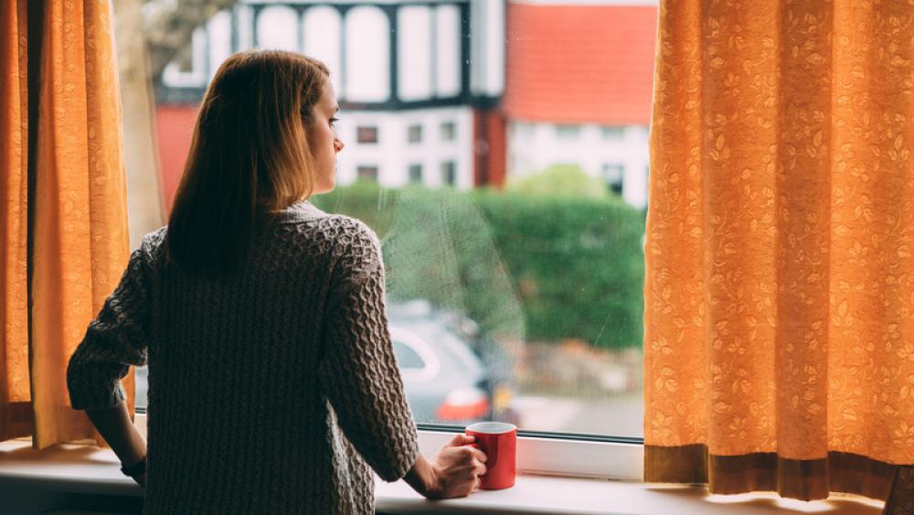 girl looking out window