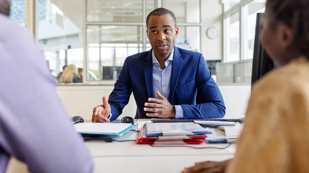 manager meeting with his employees